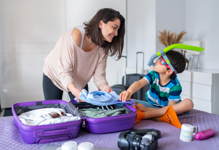 mother and son packing for a summer trip