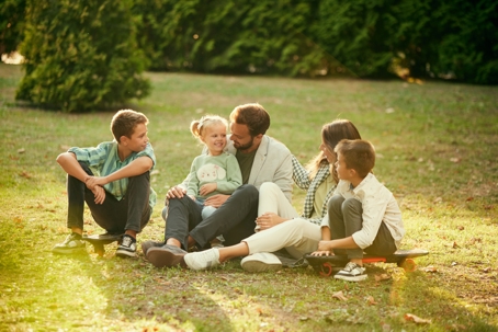blended family playing in the park